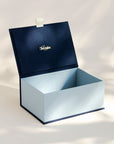 Open handcrafted keepsake box in Midnight and Steel colour with foil stamped logo