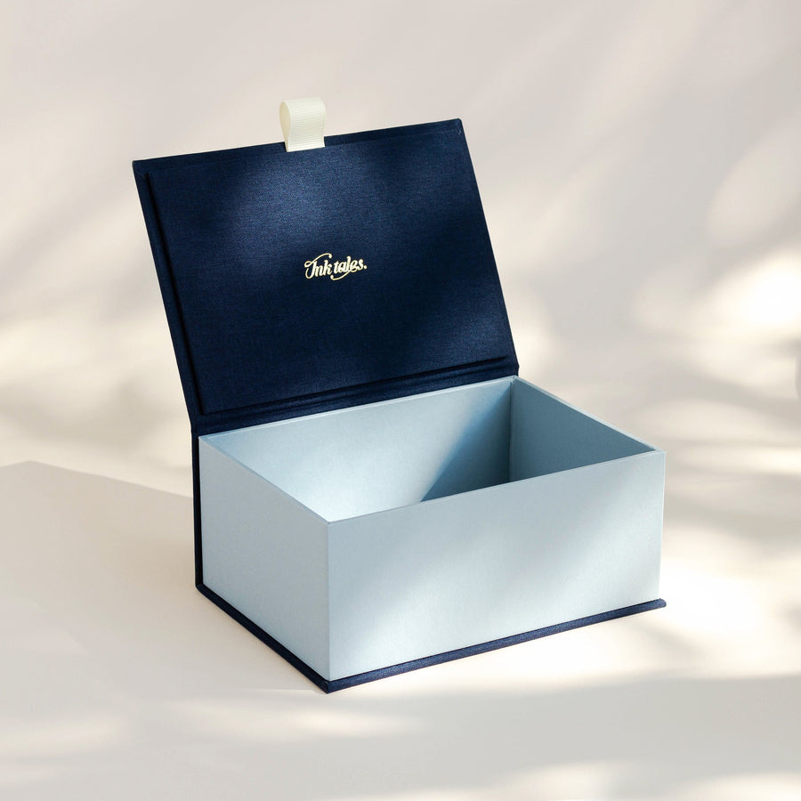 Open handcrafted keepsake box in Midnight and Steel colour with foil stamped logo