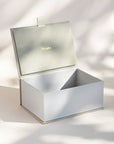 Open handcrafted keepsake box in Sand and Cobblestone colour with foil stamped logo