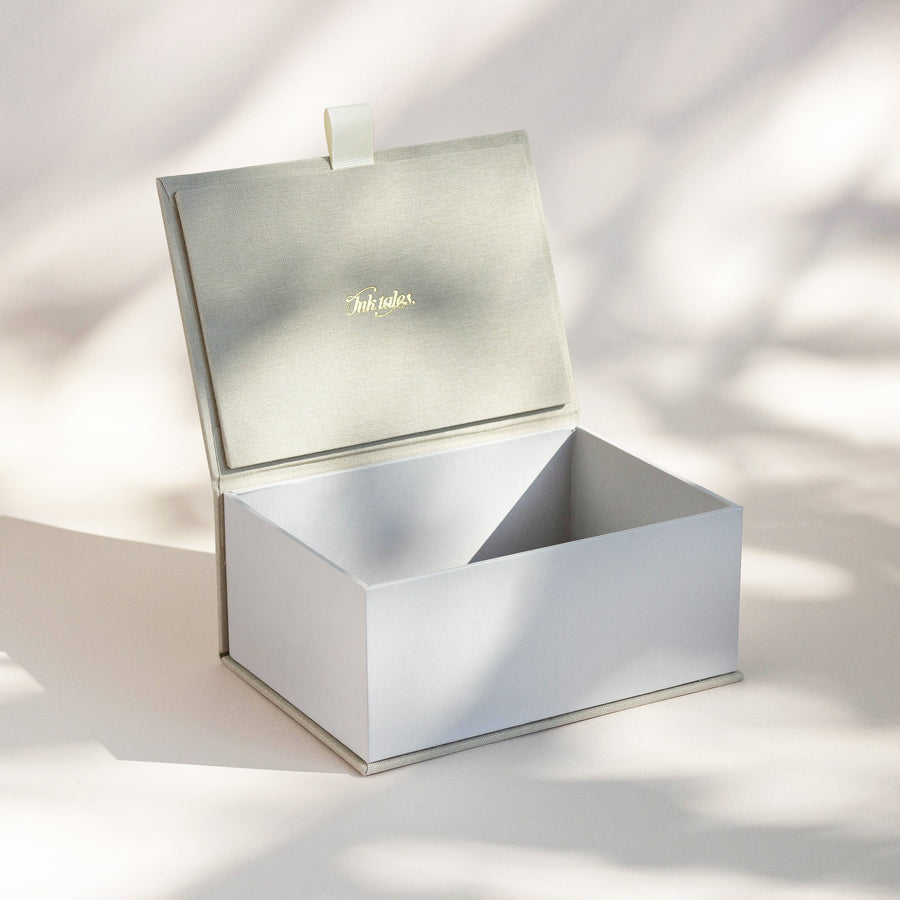 Open handcrafted keepsake box in Sand and Cobblestone colour with foil stamped logo