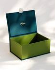 Open handcrafted keepsake box in Seaweed and Meadow colour with foil stamped logo