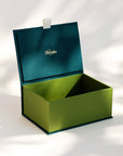 Open handcrafted keepsake box in Seaweed and Meadow colour with foil stamped logo