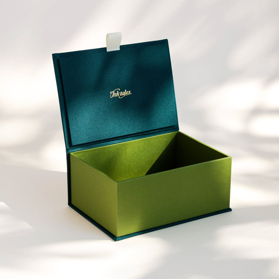 Open handcrafted keepsake box in Seaweed and Meadow colour with foil stamped logo