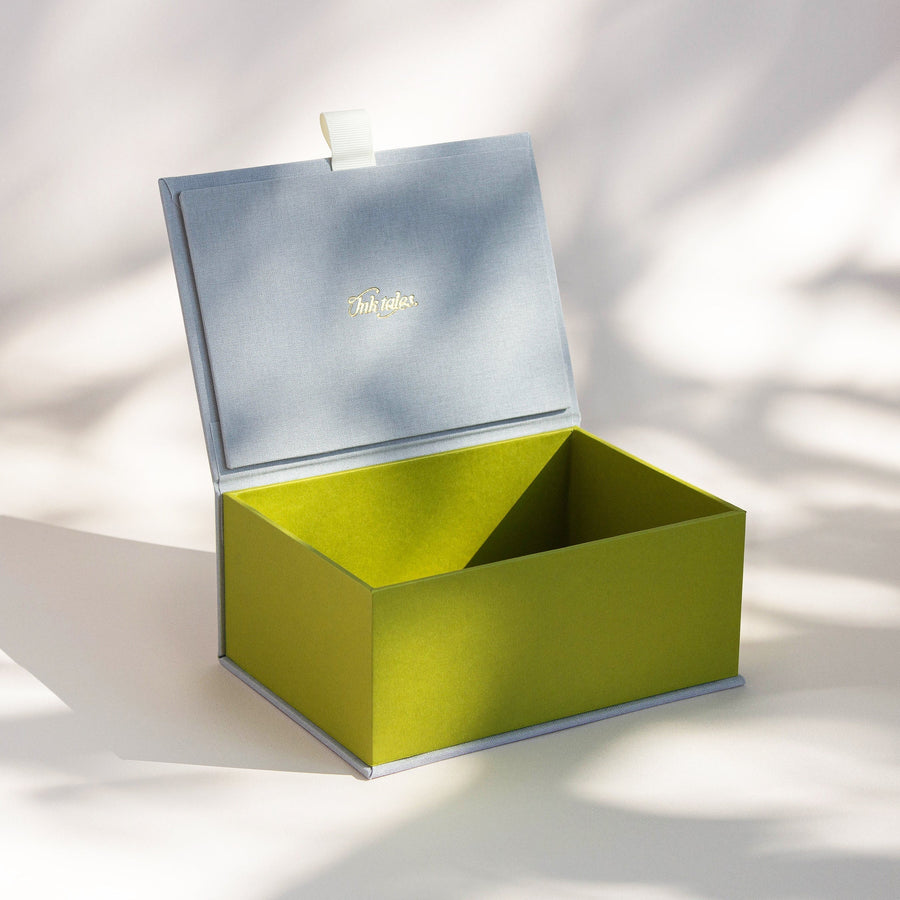 Open handcrafted keepsake box in Silver and Kiwi colour with foil stamped logo