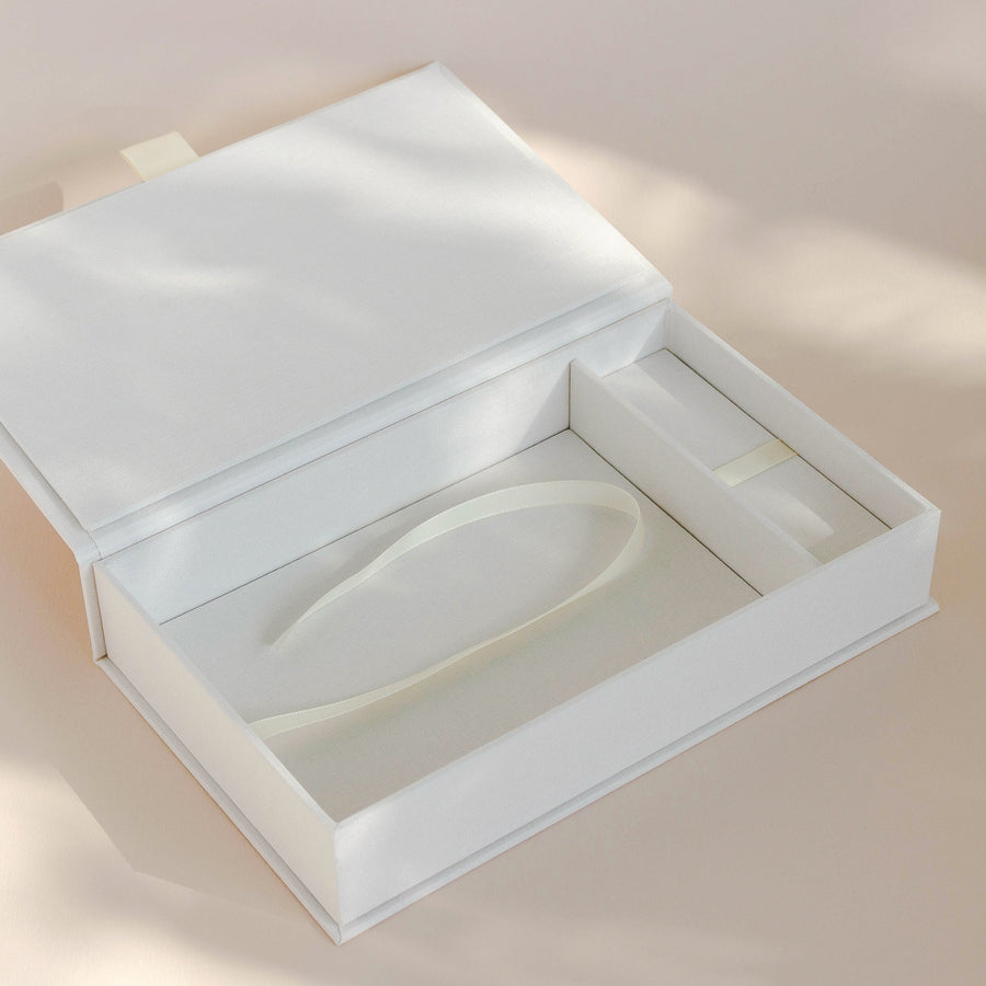 Opened handcrafted linen covered photo box with usb compartment