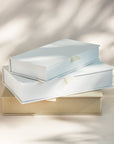 Stacked handcrafted linen covered photo boxes