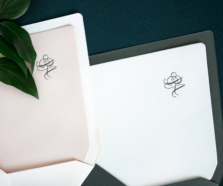Two envelopes with letterpress RA monogram printed on the liner 