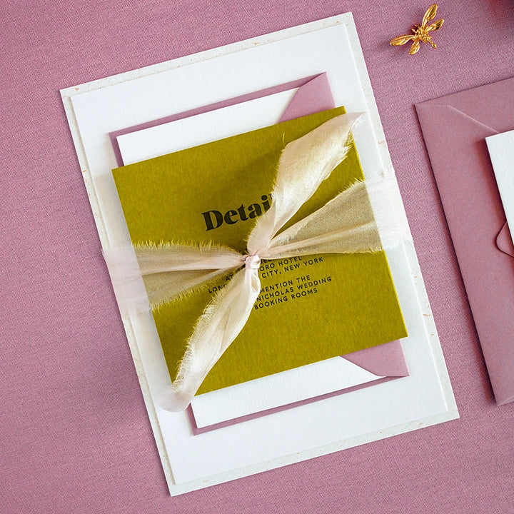 Letterpress invitation set wrapped with silk ribbon