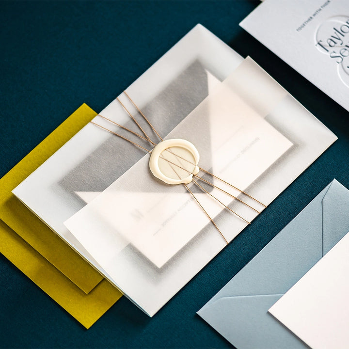 Letterpress invitation set with vellum wrap fine twine and wax seal