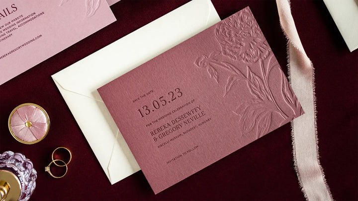 Letterpress save the date card with blind pressed peony illustration