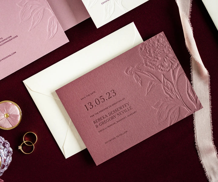 Letterpress save the date card with blind pressed peony illustration
