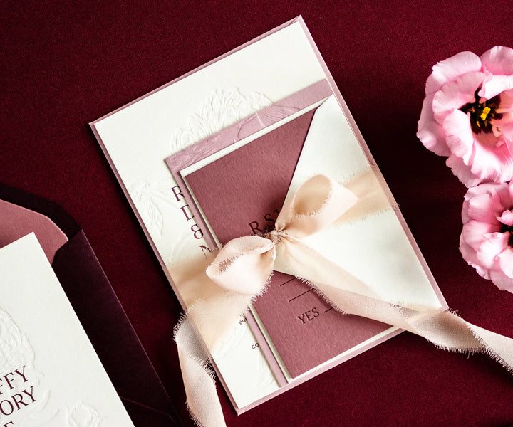 Letterpress invitation set tied with silk ribbon