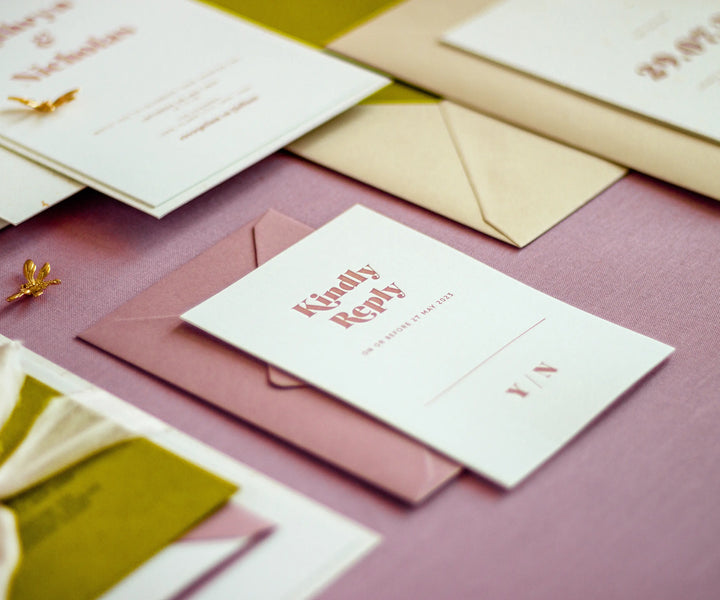 Letterpress RSVP card on pink envelope
