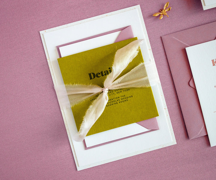 Letterpress wedding invitation set tied with silk ribbon