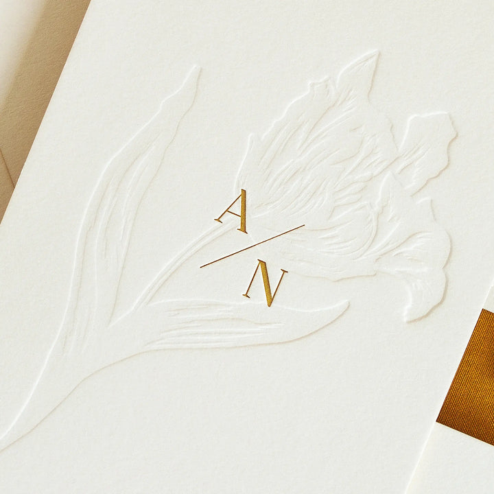 Blind letterpress tulip and yellow ink letterpress monogram